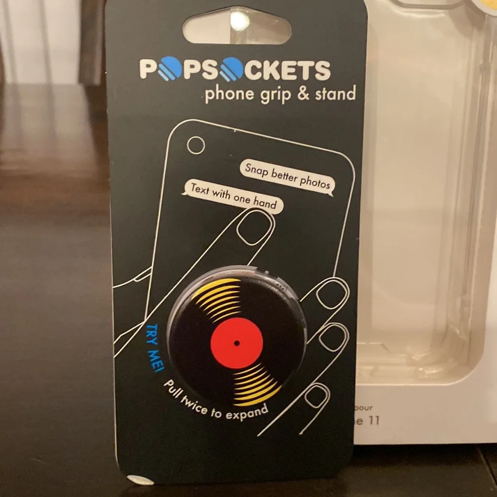 Clear case for iPhone 11 and new unopened album pop socket. NWT